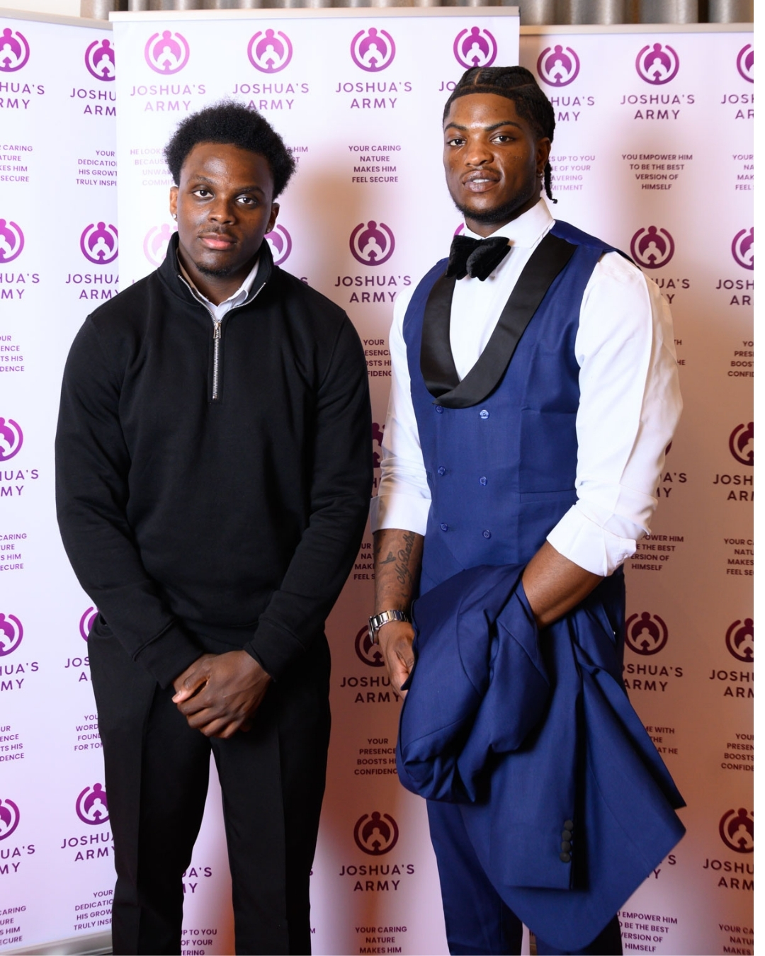 Father and son in sharp black and blue evening suits on the red carpet